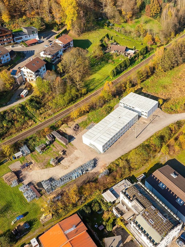 Industrial building between residential buildings and forest, refugee accommodation Beermiß, Calmbach, Black Forest, Germany