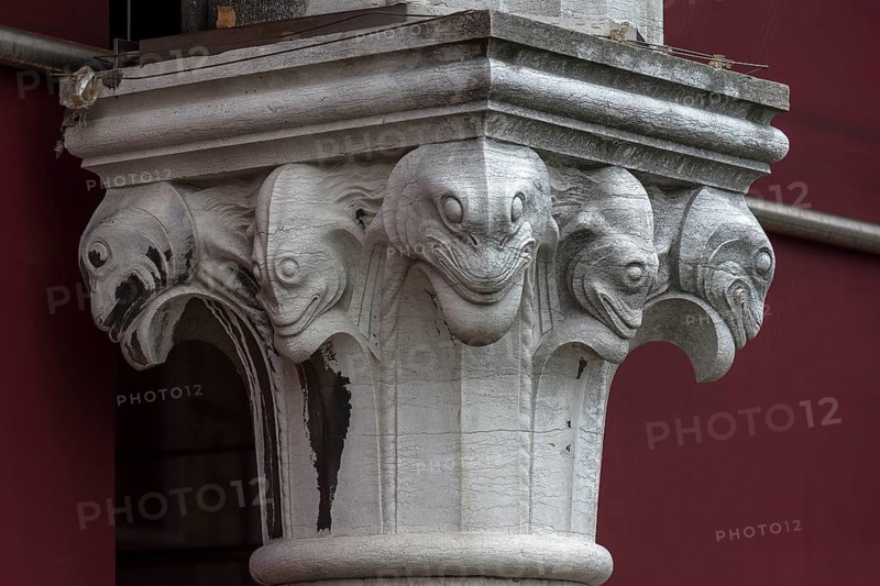 Captain design with fish figures on the arcades of the historic market in Rialto, Venice, Veneto, Italy