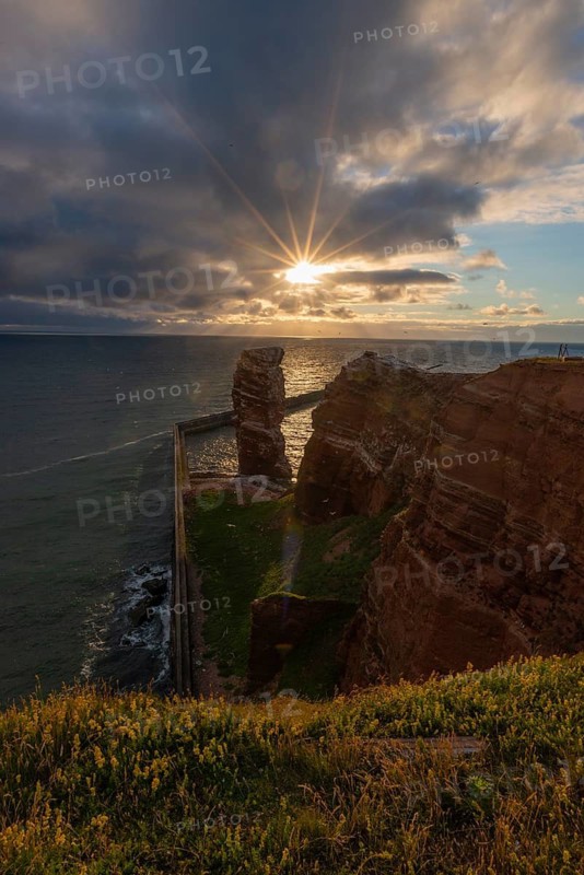 Red red sandstone cliff edge, Heligoland high sea island, Lange Anna, backlight, North Sea, blue sky, Pinneberg district, Schleswig-Holstein, Germany