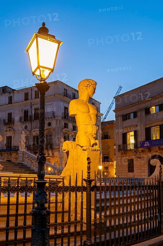 Statue close-up by night, Praetorian Fountain or Fontana Pretoria, Palermo, Sicily, Italy