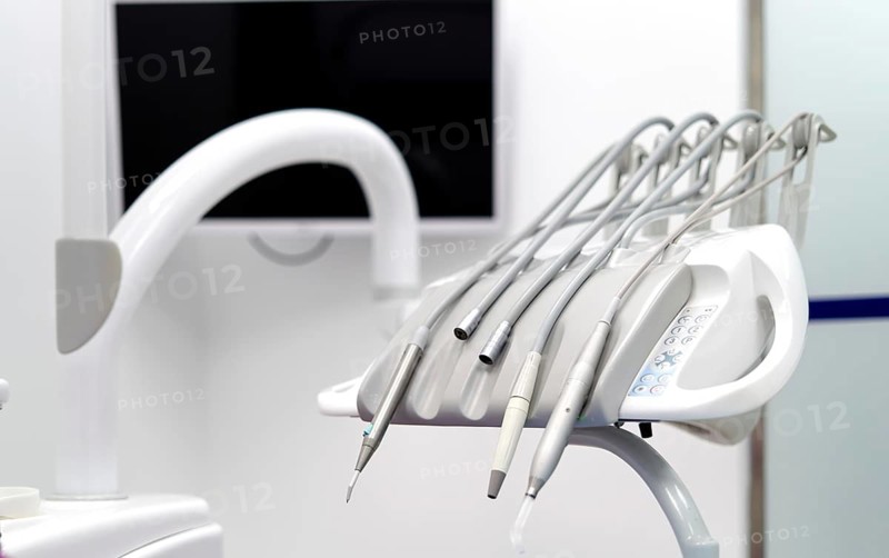 Close-up of advanced dental tools in a modern clinic, showcasing a range of instruments essential for dental procedures. The environment is sterile and professional