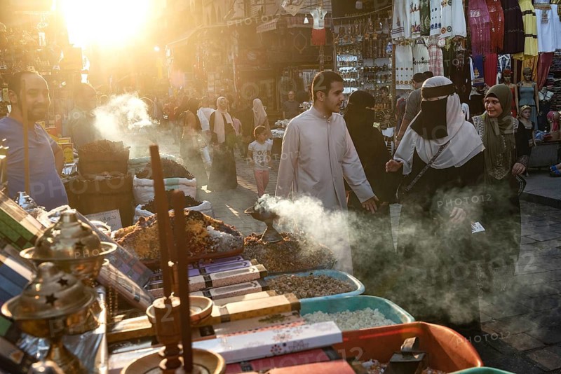 Cairo, Egypt. July 2nd 2024 Smoke from burning incense in a busy market in the historical Islamic quarter of Cairo, Egypt