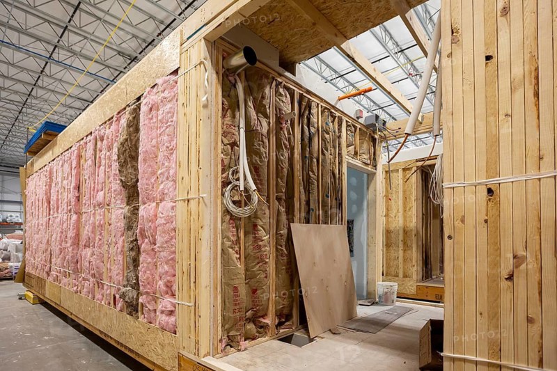 Romulus, Michigan - Workers build apartments in Ginosko Modular 's factory using modular construction methods. The units will be assembled into an apartment building in Detroit for low to moderate income households