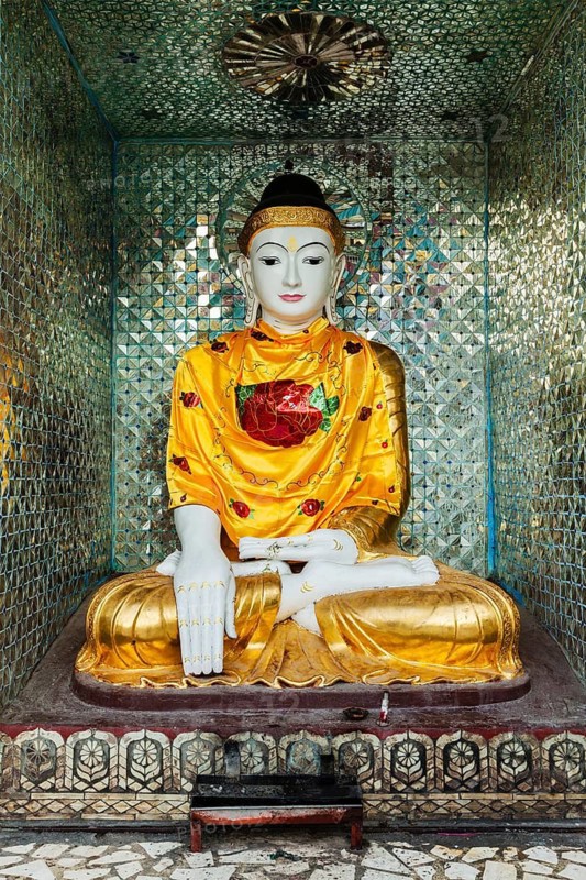 Buddha statue in Burma famous sacred place and tourist attraction landmark, Shwedagon Paya pagoda. Yangon, Myanmar