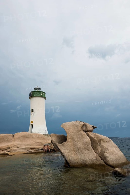 Lighthouse with beach and bizarre granite rocks, Spiaggia Porto Faro, Faro di Punta Palau, Palau, Costa Smeralda, Sardinia, Italy