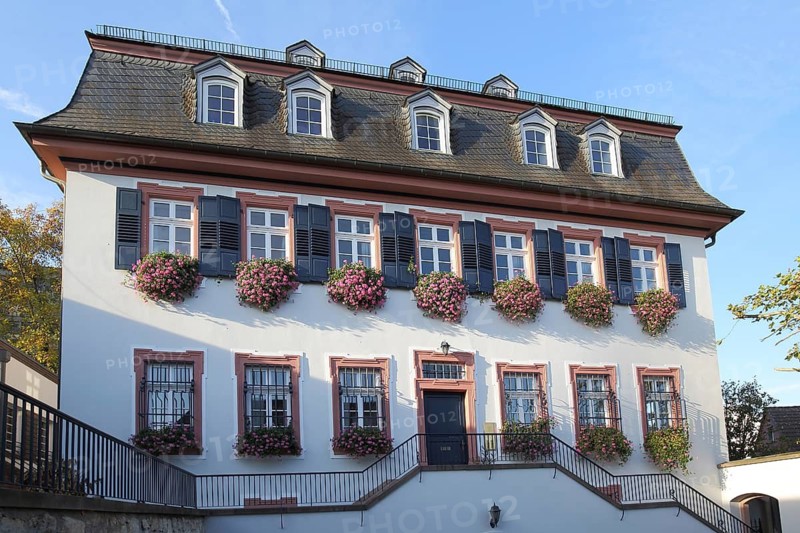Neo-baroque vicarage, half-timbered house with hipped roof, mansard roof, flower decoration, window shutters, Bodenheim, Rhine-Hesse region, Rhineland-Palatinate, Germany