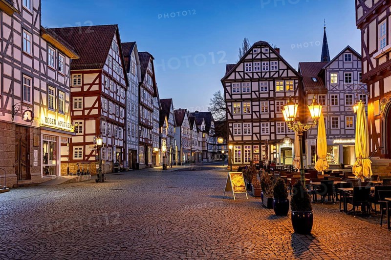 Atmospheric square with illuminated half-timbered houses at dusk, The old town centre of Melsungen