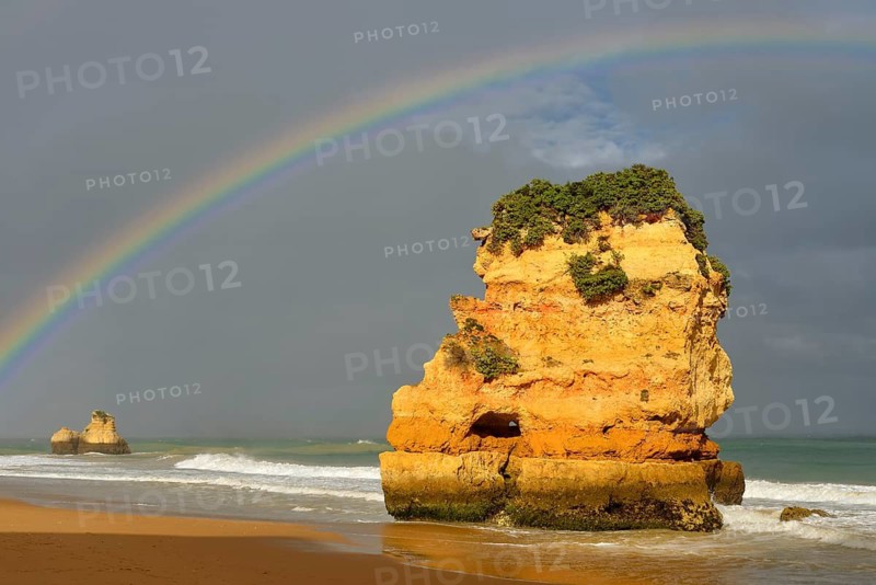 Rocks on beach with rainbow, Praia Dona Ana, Lagos, Algarve, Portugal