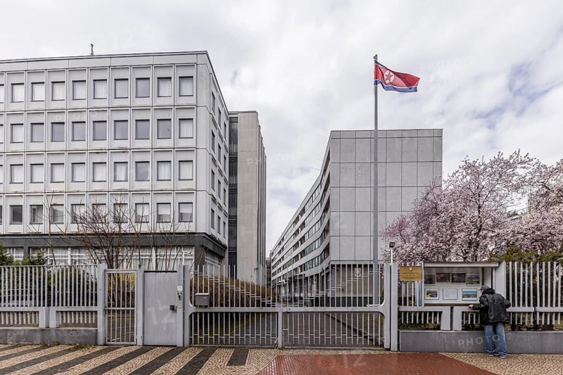 Embassy of the Democratic People's Republic of Korea. Better known as North Korea. Exterior view with state flag and fence. Berlin, Germany