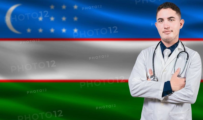 Portrait of medical professional on Uzbekistan flag background. Uzbek national health system