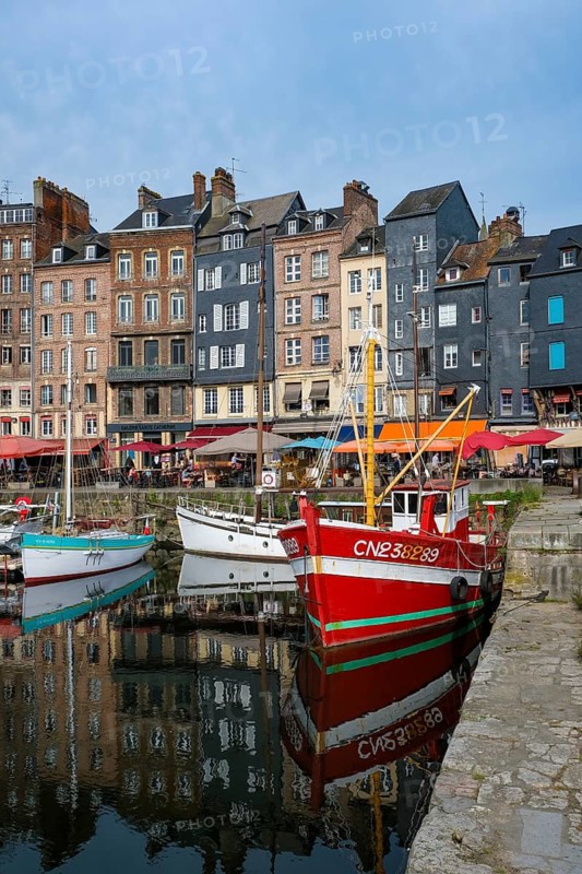 Honfleur, Normandy, France - Boats on the Quai Sainte-Catherine in the old harbour, Vieux Bassin, in the picturesque harbour town of Honfleur at the mouth of the Seine