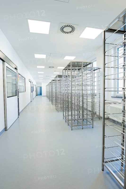 Long corridor with metal shelves in a brightly lit, sterile environment, operating room in the new Calw hospital, Calw district, Germany