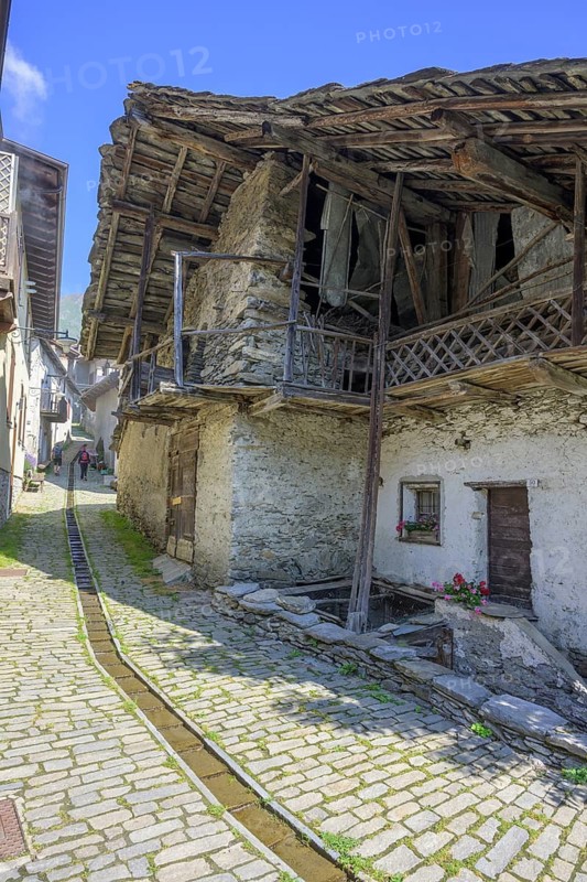 Old farmhouse in the village, Usseaux, metropolitan city of Turin, Italy