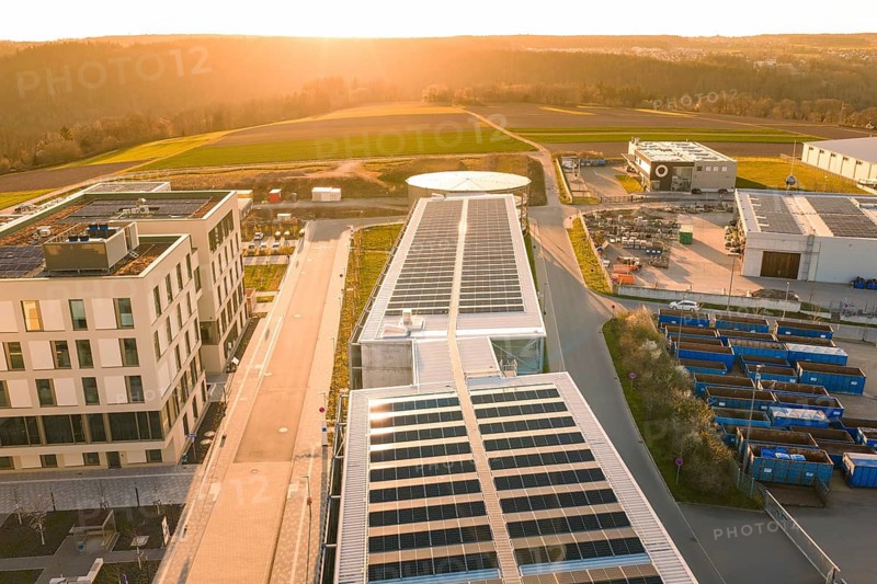 Large solar panels on modern buildings with views of landscape and sun, new hospital at the Verbund Südwest Clinic, Calw, Germany