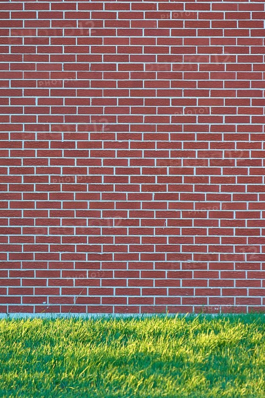 A brick wall with a meadow in front of it, Ontario, Canada