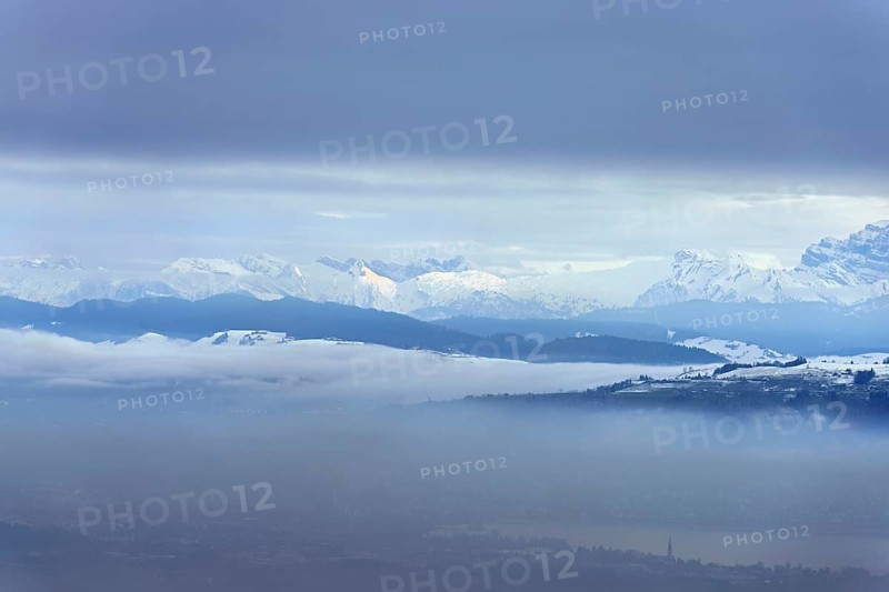 Fog over Lake Zug in the foreground the village of Cham, behind the snow-covered Alps, Beinwil, Freiamt, Horben, Lindenberg, Canton of Aargau, Switzerland