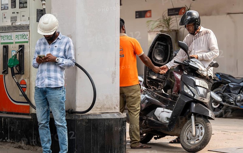 A fuel station attendant refuels a motorcycle at a petrol pump in Guwahati, India, on March 11, 2026. Oil prices reversed course from recent highs, slipping to around 90 USD a barrel after remarks by U.S. President Donald Trump on the Iran conflict. Markets remain unsettled as traders monitor the evolving geopolitical situation