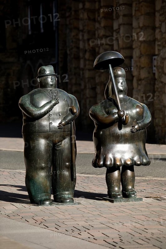 Bronze sculptures entitled Man with stick, Woman with umbrella by Fernando Botero, Goslar, Lower Saxony, Germany