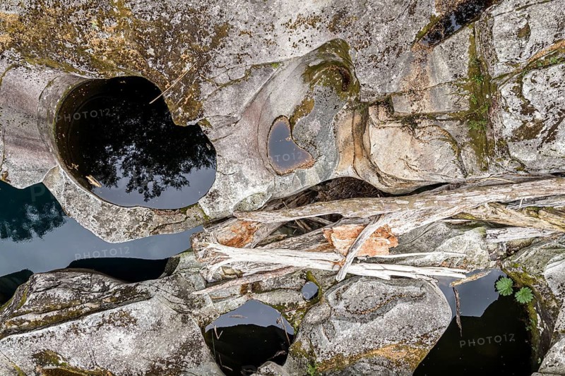 Top-down aerial view of glacial mill, dead trees, Puente Piedra near Coyhaique, Chile