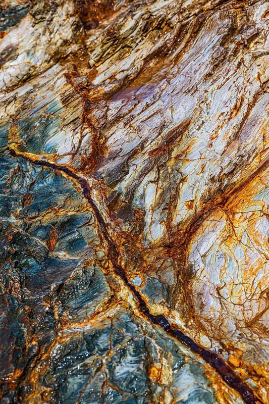 Mineralised rocks on Topinetti beach, near Rio Marina, Elba Island, Tuscan Archipelago National Park, Tuscany, Italy