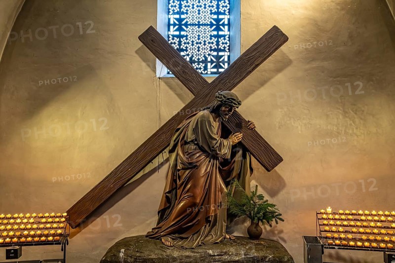 Jesus with a cross in the interior of St. Patrokli Cathedral in Soest, North Rhine-Westphalia, Germany
