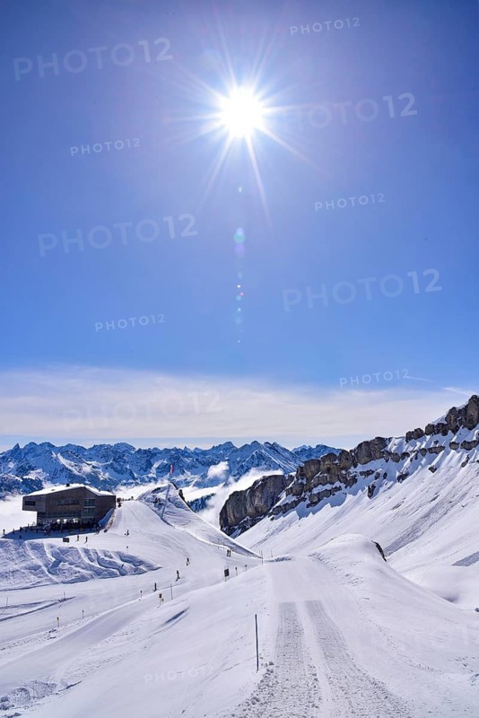 On the right the rock faces of the Hoher Ifen (2230 m) in Kleinwalsertal, on the left the mountain station of the Ifen mountain railway on the Gottesacker plateau, Allgäu, Vorarlberg, Austria
