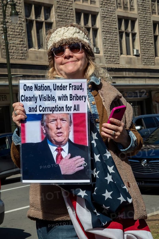 Detroit, Michigan USA - 28 March 2026 - People gathered at more than 100 'No Kings' rallies across Michigan. They were fighting to preserve democratic institutions, and protesting President Trump's actions against immigrants and getting the U.S. into a new foreign war
