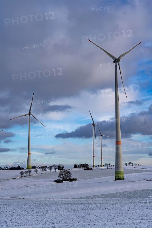 Wind farm, north of Lichtenau, self-proclaimed energy town, over 190 wind turbines and over 1200 solar panels generate 10 times as much electricity as the community of 11, 900 inhabitants consumes, largest onshore cluster of wind turbines in Germany, winter, slightly snow-covered landscape, North Rhine-Westphalia, Germany