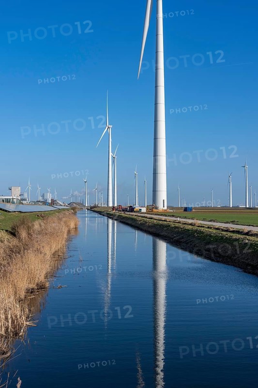 Wind farm on the Slaperdijk dike near Eemshaven, on which dikes are, as a test project, 17000 solar modules installed on a good 5 km, the Netherlands has over 22, 000 km of dyke line, here it is being tested whether such an installation is successful and can be expanded, Groningen, the Netherlands