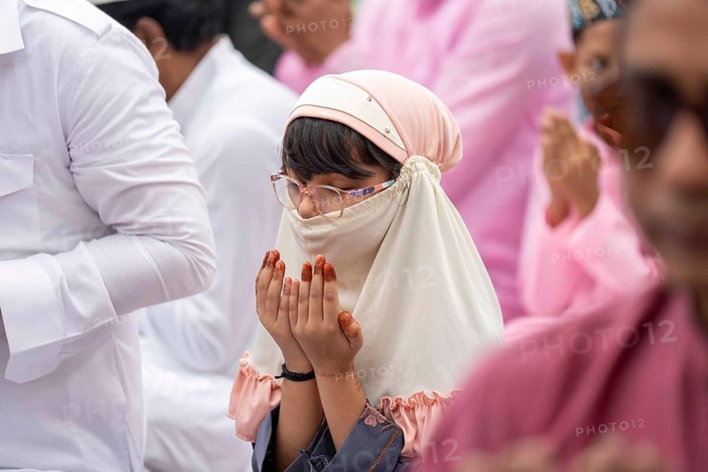 A Muslim girl child with elders attend to Eid al-Fitr prayer at Eidgah, on March 21, 2026 in Guwahati, India. Muslims make up a sizeable minority of India's population and celebrate Eid along with muslims across the world at the end of Ramadan