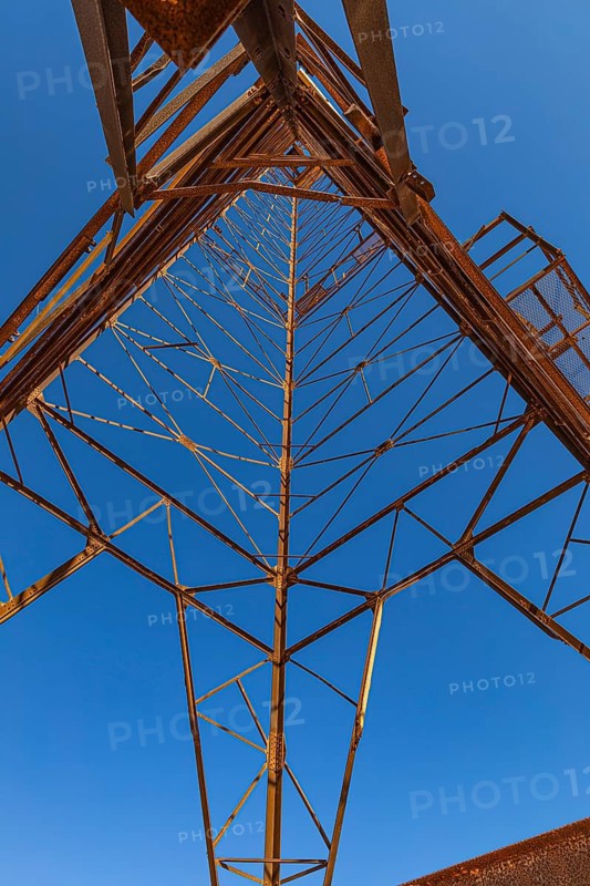 Rusted remains of a former oil derrick, Arabian Peninsula, Sultanate of Oman