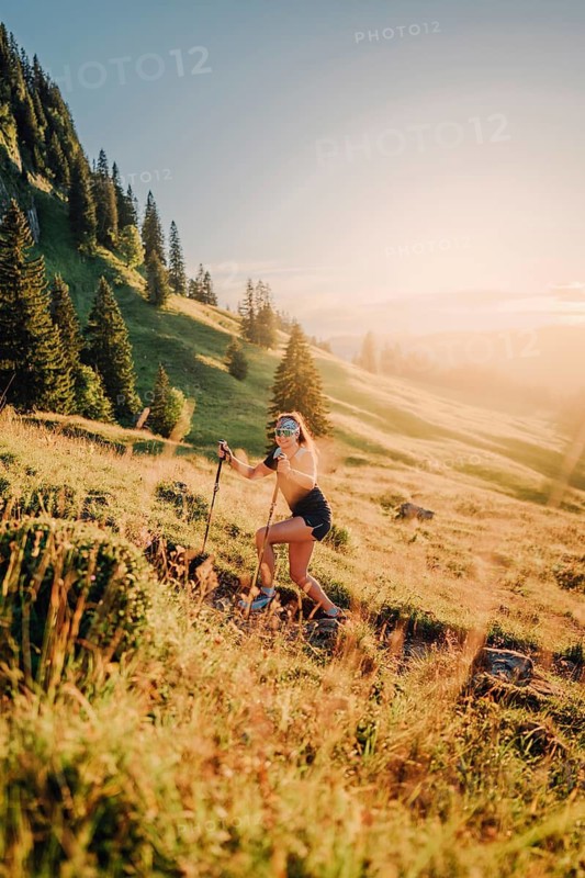 Summer trail running and hiking in the Alps on the Riedberg Pass between Obermaiselstein and Balderschwang in the Allgäu, Bavaria, Germany