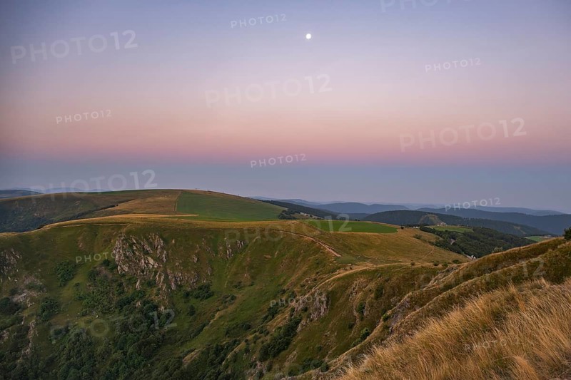 Sunrise mith the moon at Mount Hohneck in the Vosges Mountains, France