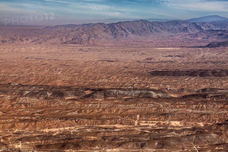 Barren desert landscape with rolling hills and wide horizons, the landscape and desert near Nasca in the Andes of Peru