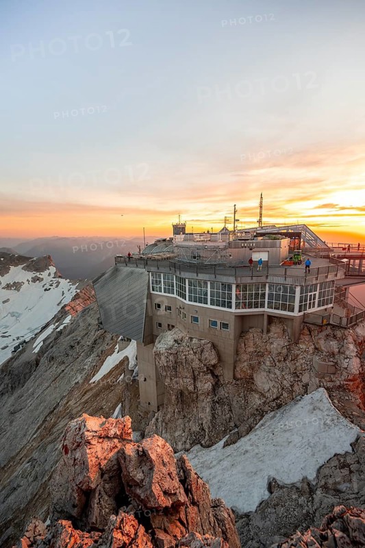 Modern mountain station of the Bavarian Zugspitze railway at the summit of the Zugspitze, view of Eibsee lake, at sunset, Wetterstein Mountains, Northern Limestone Alps, Bavaria, Germany