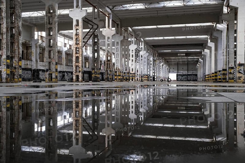 LUBIN, POLAND - MARCH 15, 2023.The ruin of a warehouse with puddles on the floor