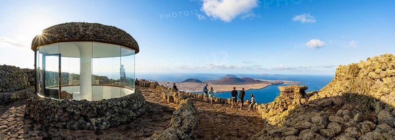 Stairway and viewing platform at the Mirador del Río viewpoint, in the evening light with sun stars, designed by artist César Manrique, view of the island of La Graciosa, Lanzarote, Canary Islands, Spain