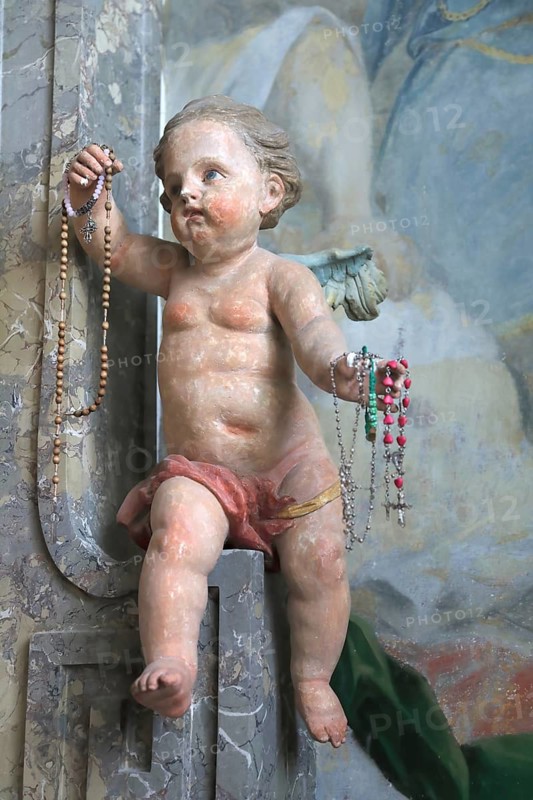 Benediktbeuern Abbey, former Benedictine Abbey, today a branch of the Salesians of Don Bosco, cherub with rosary in hand, choir room of the monastery church of St. Benedict, Bad Tölz-Wolfratshausen district, Upper Bavaria, Bavaria, Germany