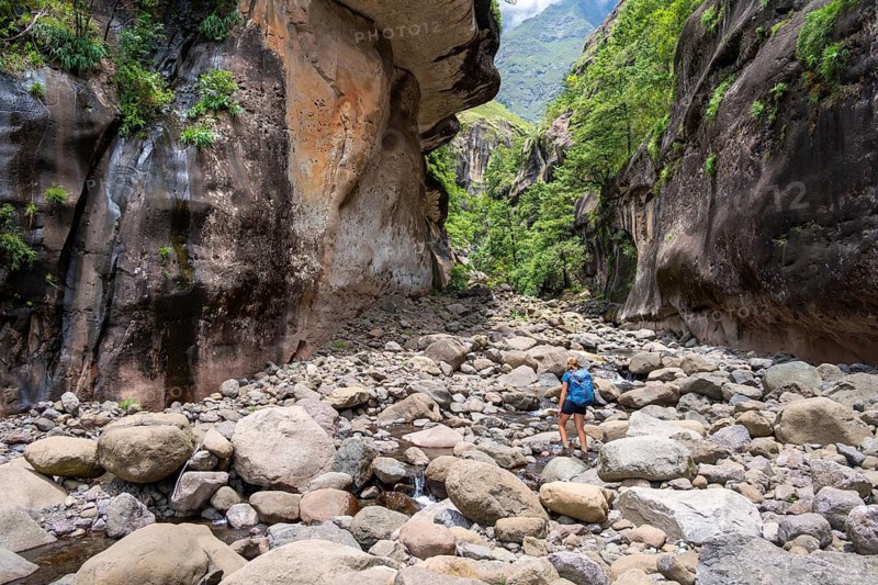 Female hiker in the Tugela Gorge or Tugela Gorge in the riverbed, Drakensberg National Park, KwaZulu Natal, South Africa