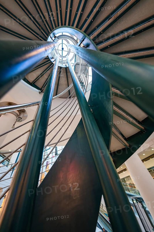 Dramatic perspective on a spiral staircase with a modern metal and glass design, Sterncenter Sindelfingen, Böblingen district, Germany