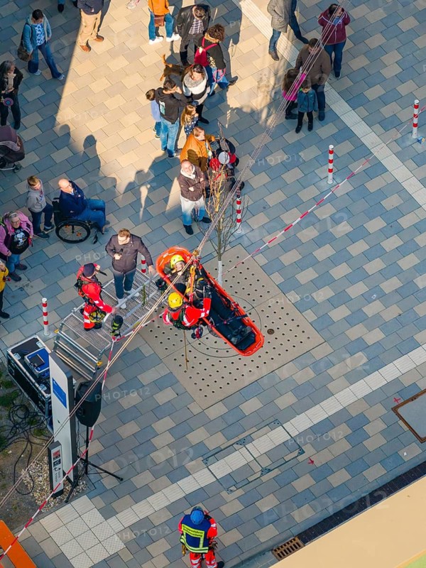 Rescue simulation with people on a paved square from above, opening hospital, Calw, Germany