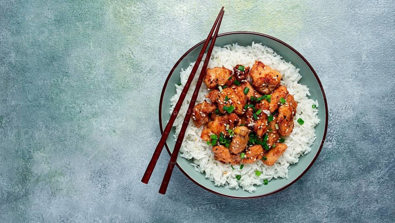 Fried chicken teriyaki with rice, green onion and sesame, homemade, no people