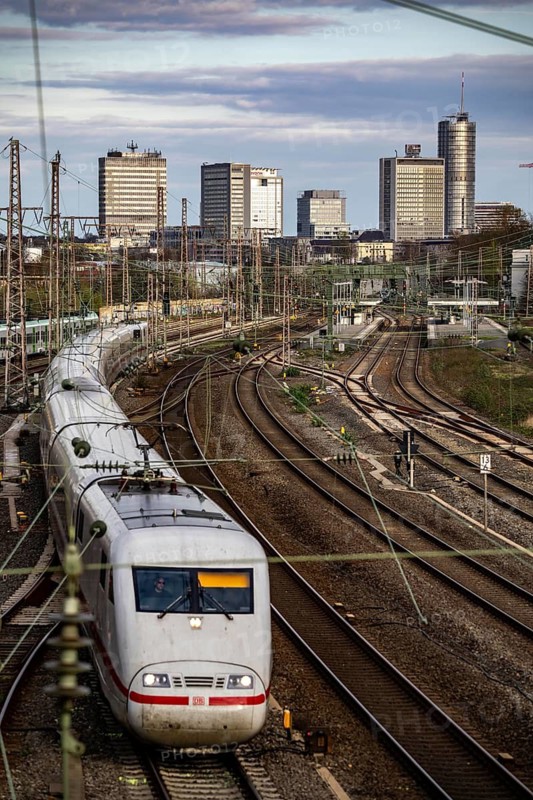 Train on the tracks west of Essen central station, skyline of the city centre, ICE train, North Rhine-Westphalia, Germany