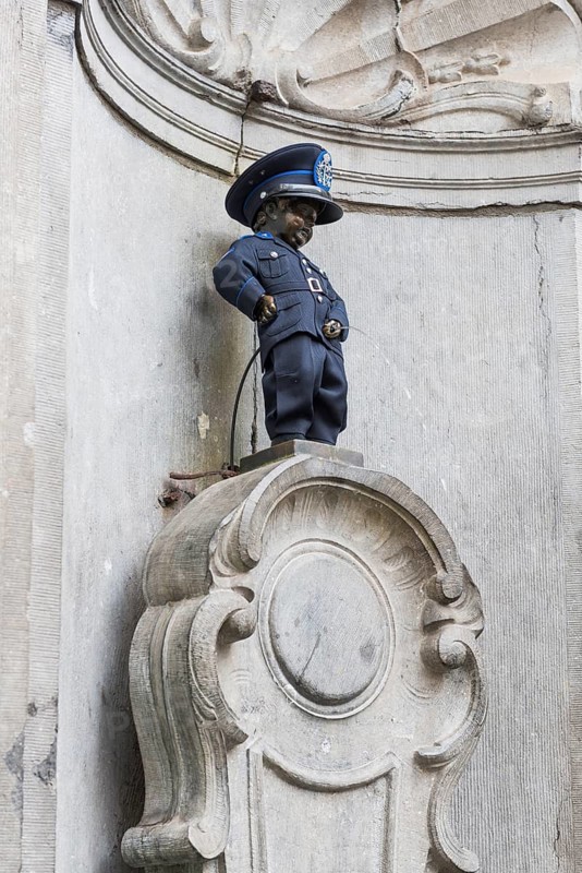 Manneken Pis as policeman, boy, pee, fountain, attraction, disguised, statue, famous, tourism, city trip, Brussels, Belgium