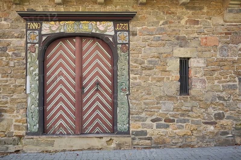 Gate dated 1771 and decorations, flank tower, wood carving, building, Goslar, Harz, Lower Saxony, Germany