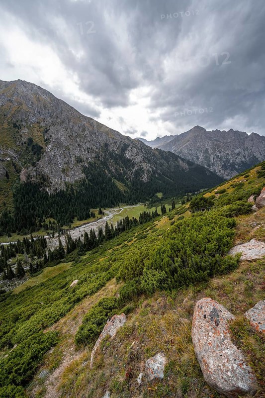 Green mountain valley with river and steep mountain peaks, Chong Kyzyl Suu Valley, Terskey Ala Too, Tien-Shan Mountains, Kyrgyzstan