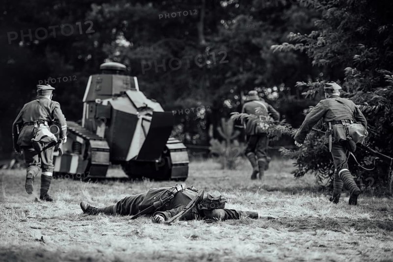 A staging battle field in World War I - attack tank and soldiers