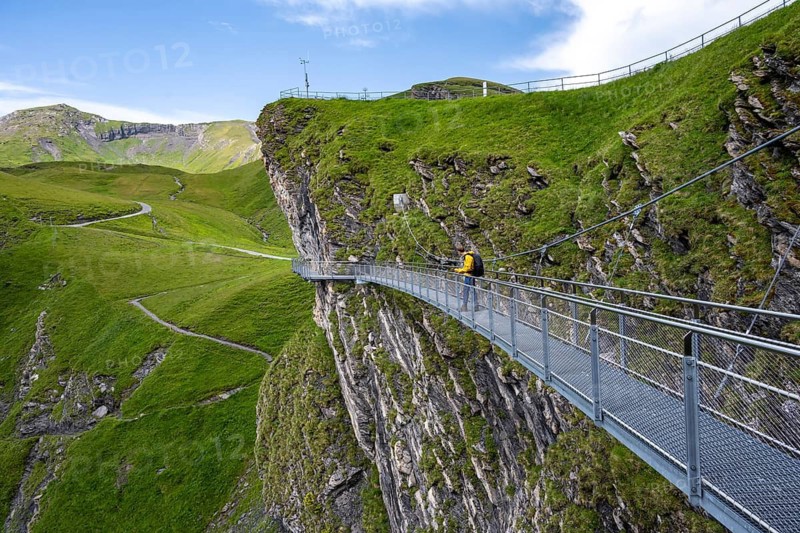 Tourist on First Cliff Walk, metal trail on a rocky outcrop, Grindelwald First, tourist attraction, Bernese Alps, Bernese Oberland, Switzerland