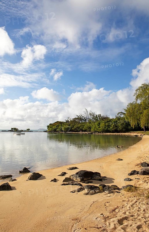 Golden sandy beach on the Indian Ocean near Calodyne, with Gunner's Coin Island in the background, Riviere du Rempart district, Mauritius