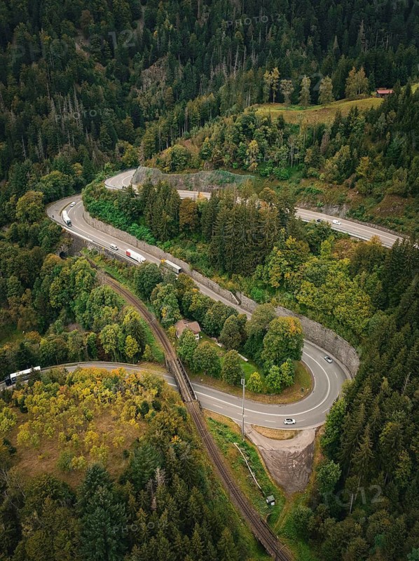 Serpentine road winds through dense forest in bird's eye view, Ravenna Gorge, Black Forest, Germany